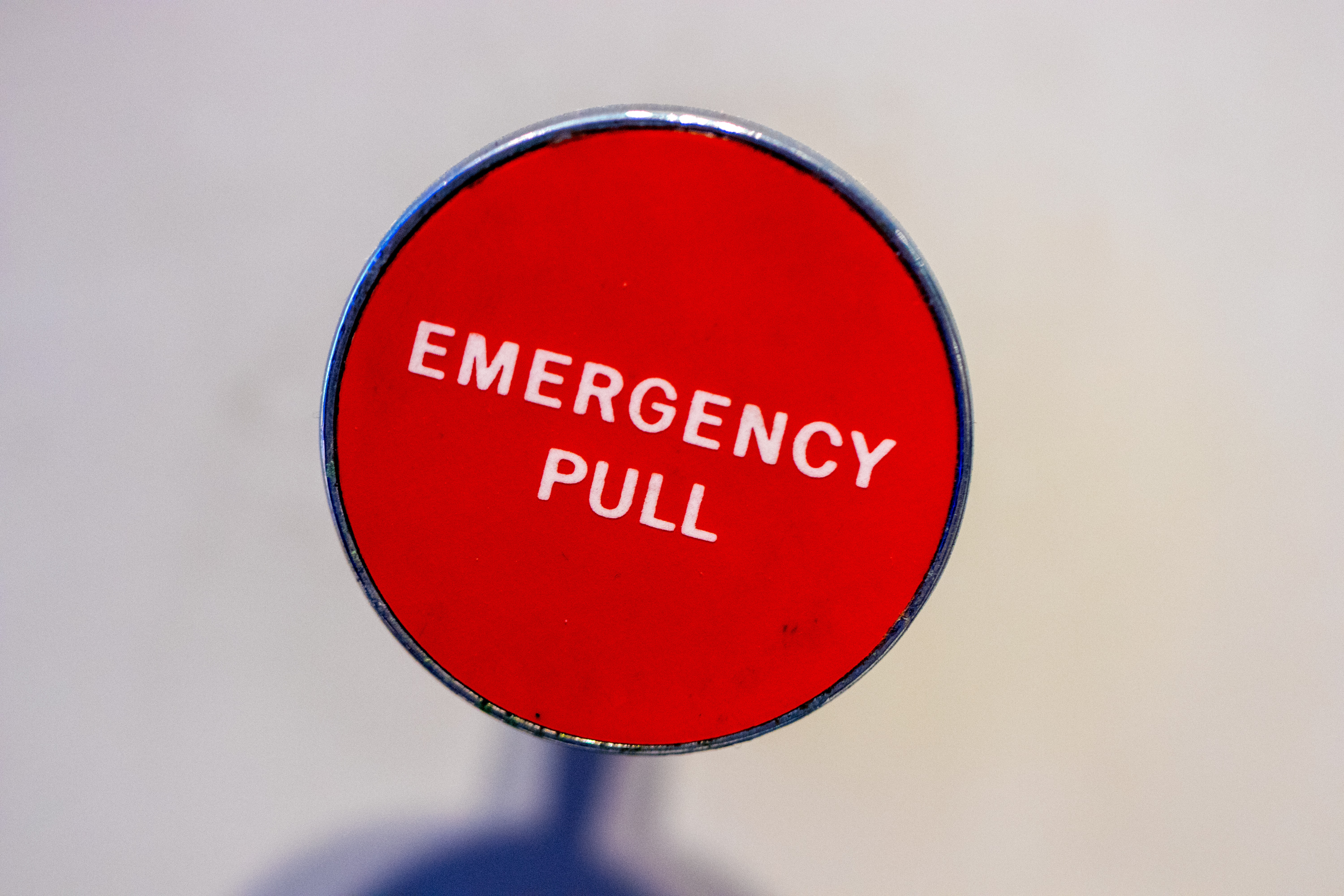 Photo by Jason Leung, unplush emergency pull - text on a photo