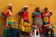 Women in colourfull colombian dresses.