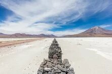 View of a gas pipeline that vanishes in the infinite next to the road B-145, province of El Loa, northern Chile.