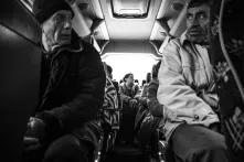 men in the bus black and white picture