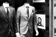Men's suits in the shop's showcase, on the left side, Che Guevara's picture is hanging.