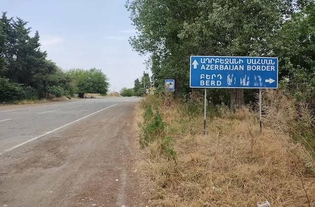 image depicts the sign "Azerbaijani  Border"