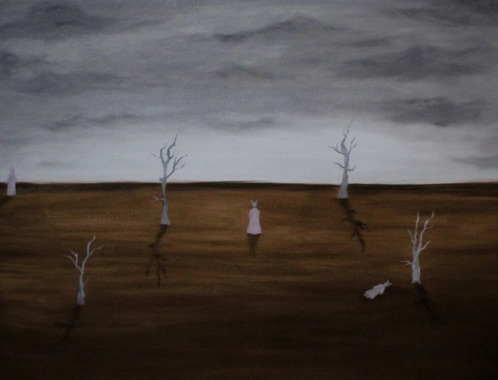 Deserted landscape with empty trees and a human figure.